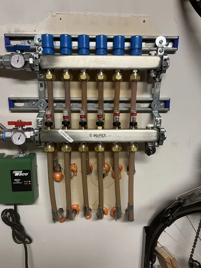 Plumber performing Water Heater Repair at a residential property in Collierville